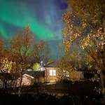 House In The Lights And Aurora Nyaraló